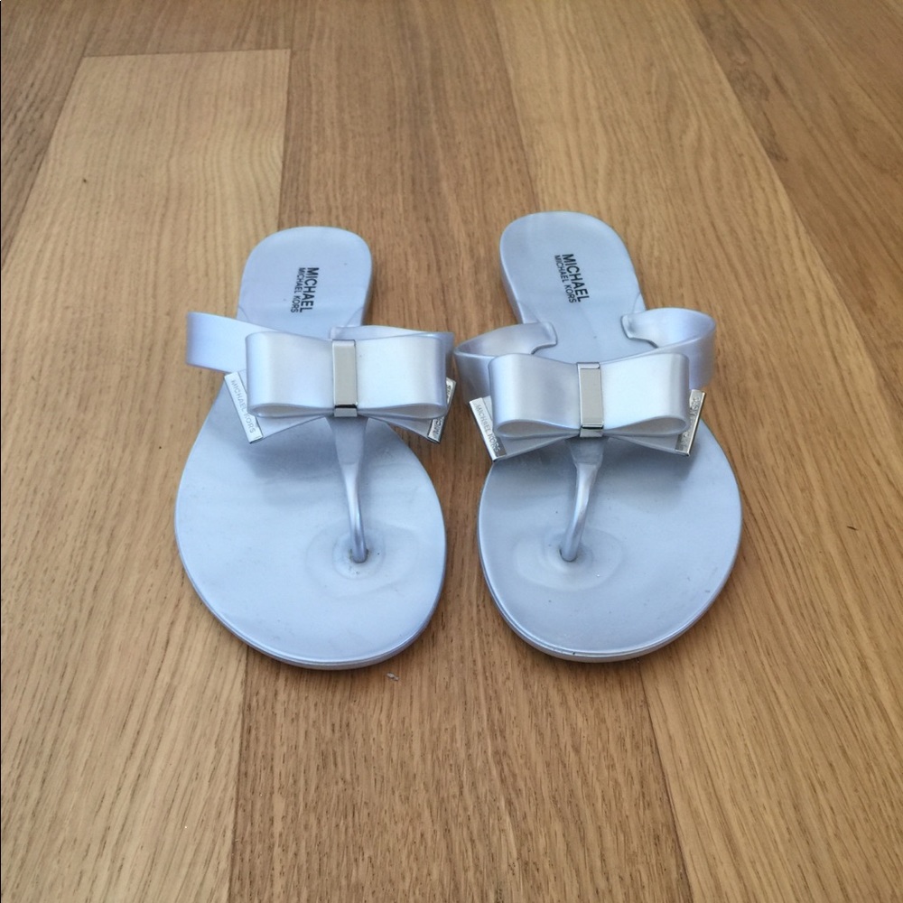 Women Michael Kors silver bow slippers size 8